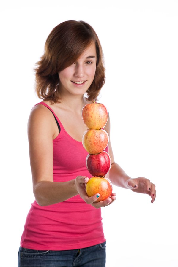 bigstockphoto Teenage Girl Balancing Several 4630187